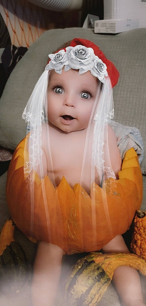 Juniper is registered to the contest to win money with this photo: art, bridal_accessory, bridal_veil, calabaza, child, dress, event, eye, eyelash, fashion_design, gourd, hair_accessory, headpiece, headwear, jewellery, makeover, person, pumpkin, surprise, toddler