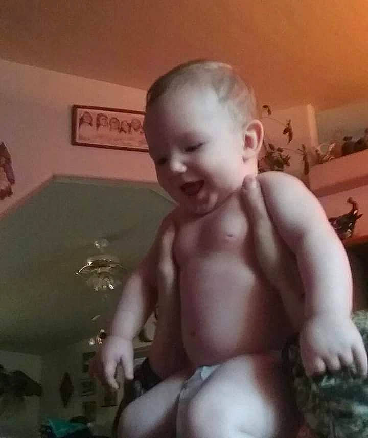 Cash is registered to the contest to win money with this photo: abdomen, baby, barechested, bathing, bathtub, cheek, chest, child, ear, eye, eyebrow, flooring, fun, jaw, mouth, person, smile, stomach, thumb, toddler