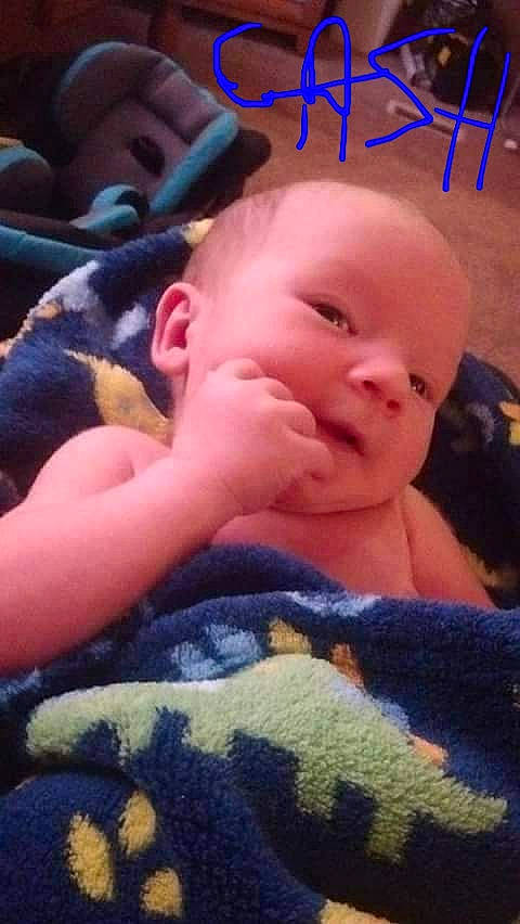 Cash is registered to the contest to win money with this photo: abdomen, baby, baby_toddler_clothing, bedtime, blue, cheek, child, comfort, finger, fun, grass, happy, mammal, nose, person, skin, smile, textile, thumb, toddler