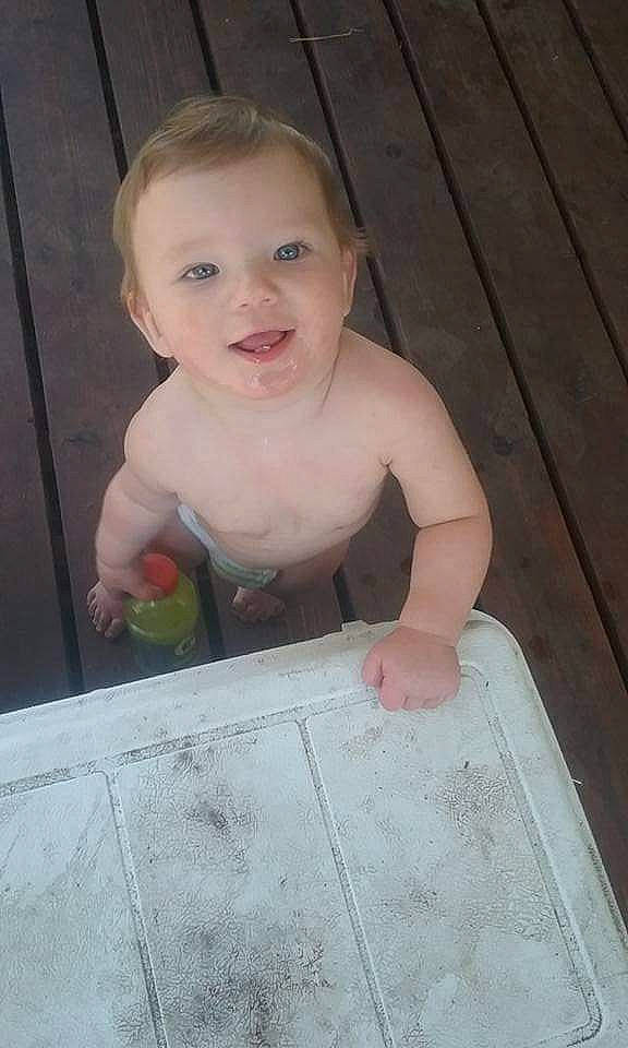 Cash joined the competition — help win amazing prizes! baby, baby_toddler_clothing, cheek, face, facial_expression, floor, flooring, fun, hairstyle, hardwood, head, iris, lip, mouth, nose, person, sitting, skin, smile, toddler