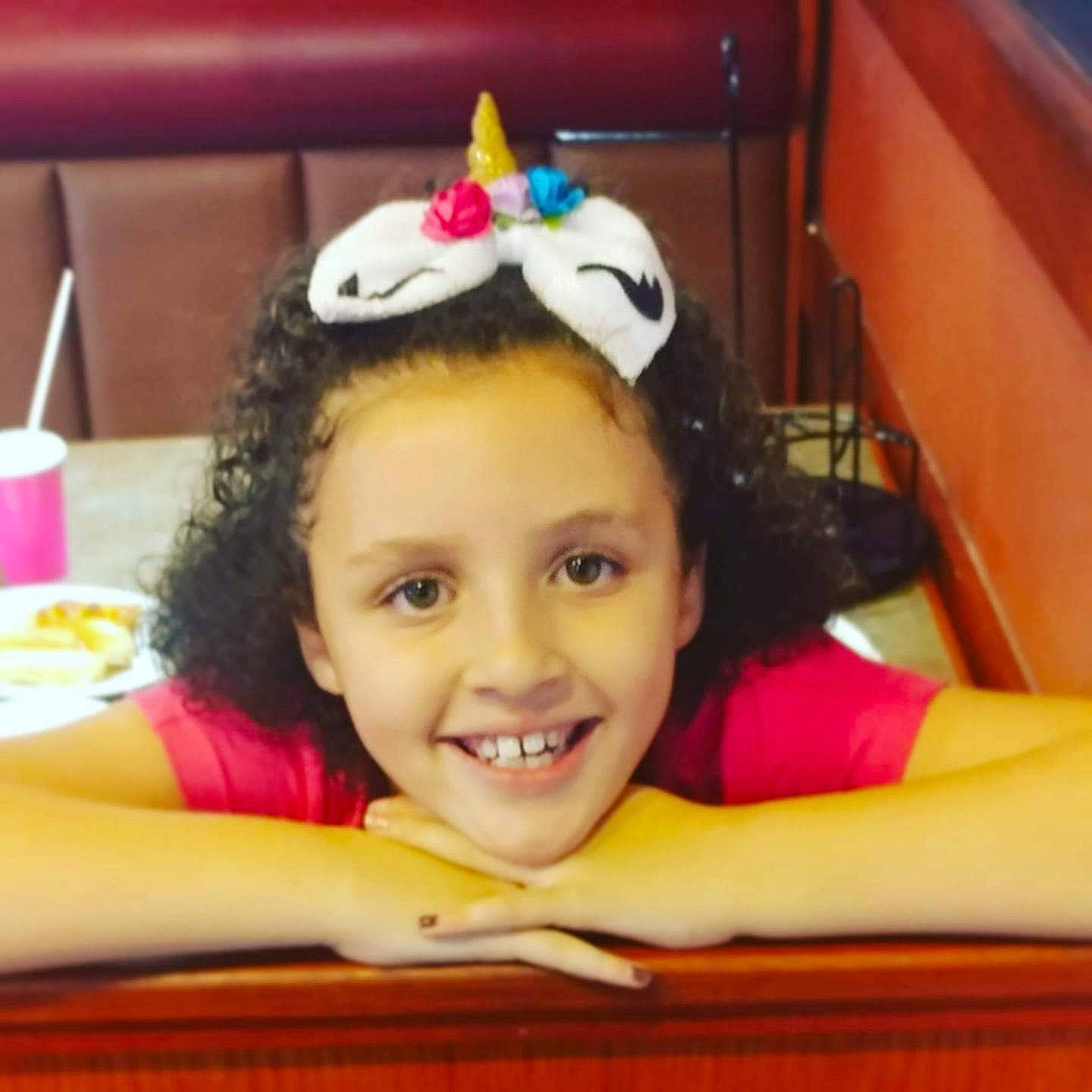 Amiah is registered to the contest to win money with this photo: baby, birthday, cheek, child, ear, face, fun, hair_accessory, happy, head, headgear, joy, party_hat, person, play, skin, smile, toddler