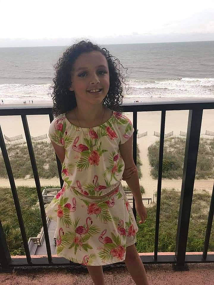 Amiah joined the competition — help win amazing prizes! beach, child, dress, fawn, happy, joy, neck, person, sea, shoulder, sitting, smile, summer, vacation