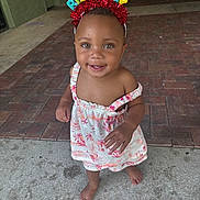 Zelilah joined the competition — help win amazing prizes! toddler, child, birthday_headband, smile, barefoot, dress, happy, standing, outdoor, floor, concrete, brick, person, cute, colorful, headwear, celebration, young_child, skin, eyes