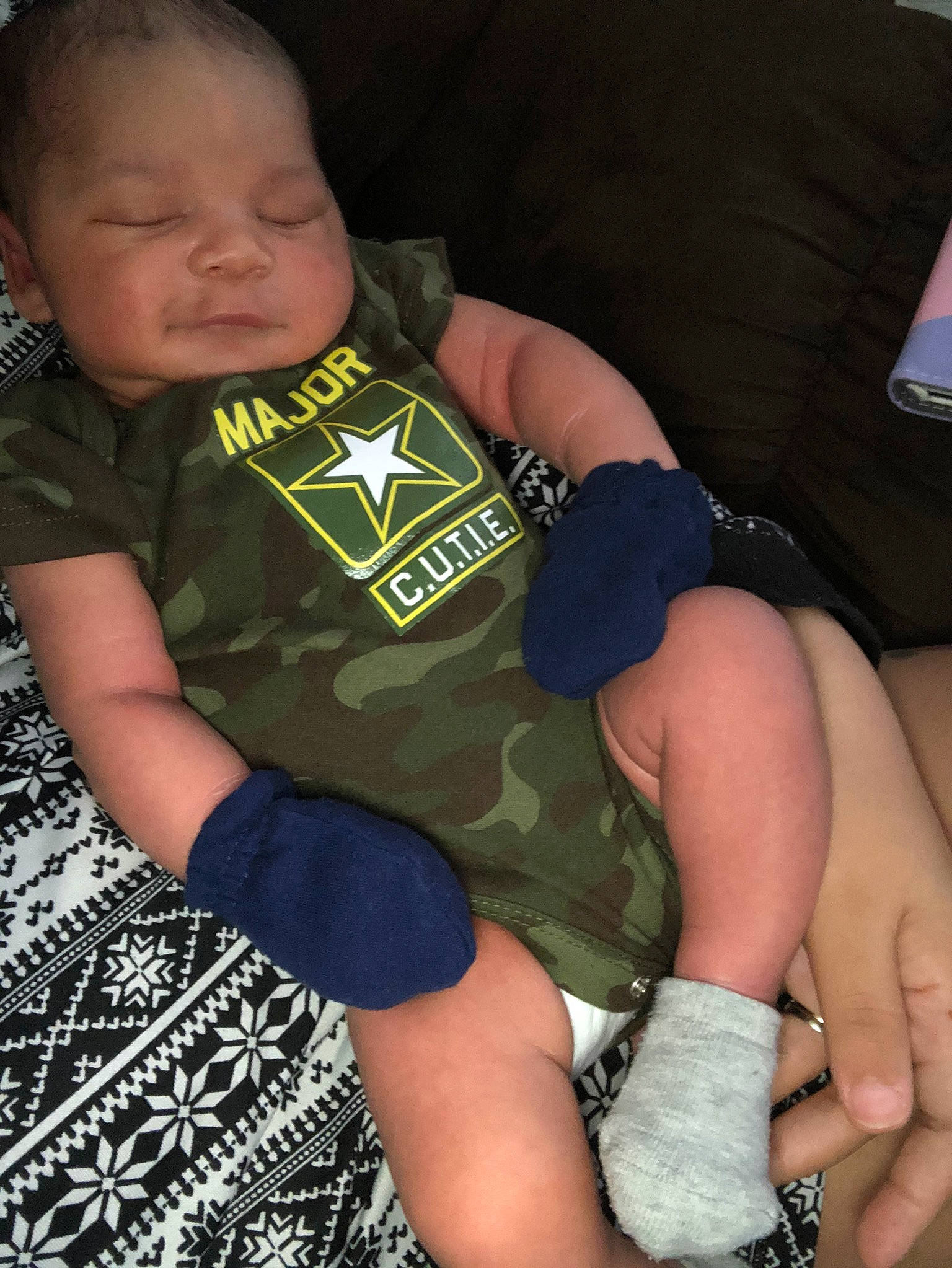 Kacen is registered to the contest to win money with this photo: arm, child, finger, lap, leg, person, sitting, toddler