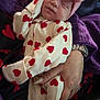 baby, blanket, bodypart, bonnet, cap, clothing, face, finger, hand, hat, head, hood, newborn, pattern, person, photography, portrait, purple, sleeping, wristwatch