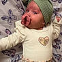 applique, baby, beanie, bodypart, bonnet, cap, clothing, face, finger, footwear, hand, hat, head, knitwear, newborn, person, photography, portrait, shoe, sweater