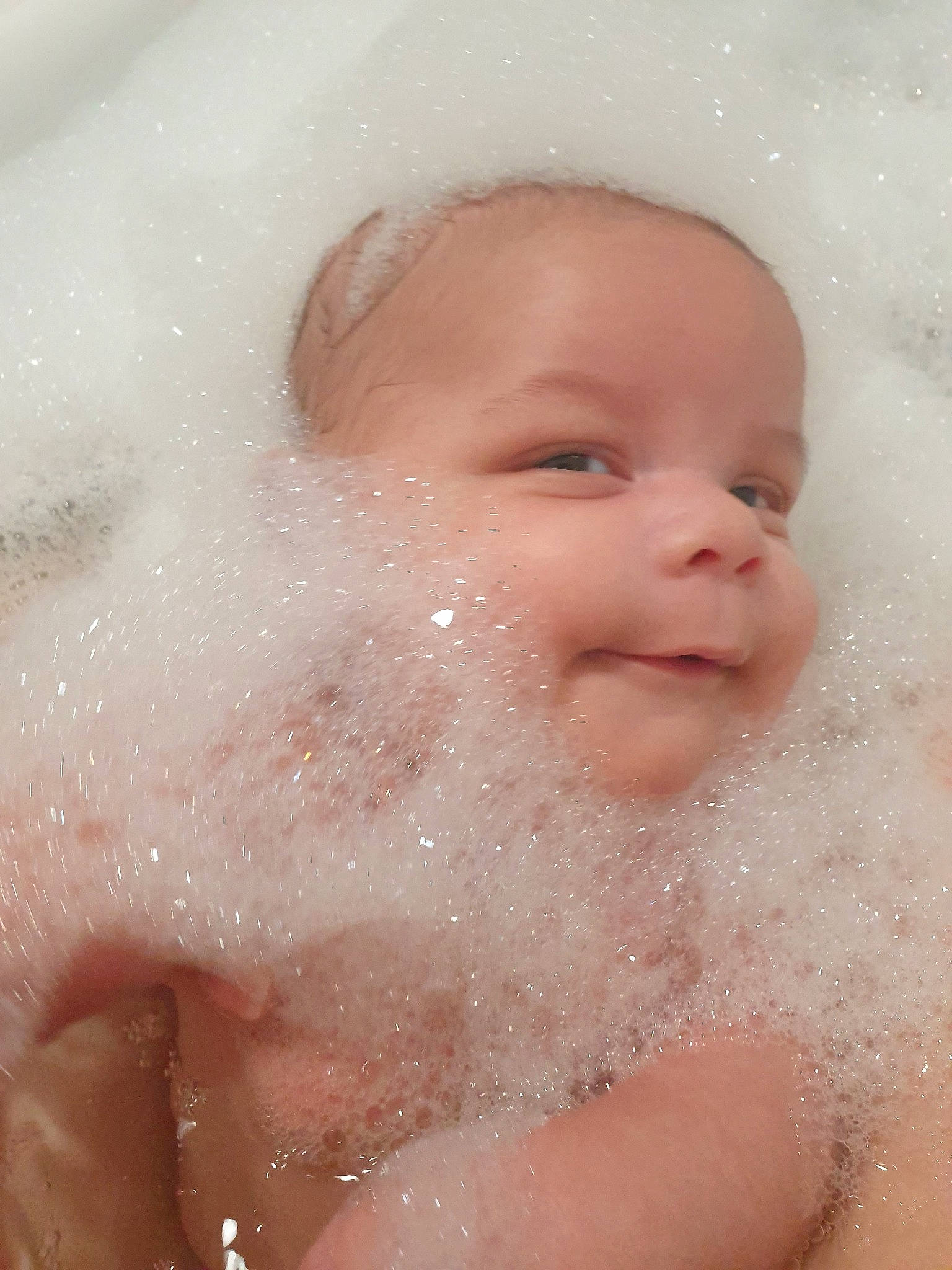 Aston is registered to the contest to win money with this photo: baby, baby_bathing, bathing, bathtub, cheek, child, chin, close_up, eye, eyebrow, face, foam, forehead, head, lip, mouth, nose, person, skin, toddler