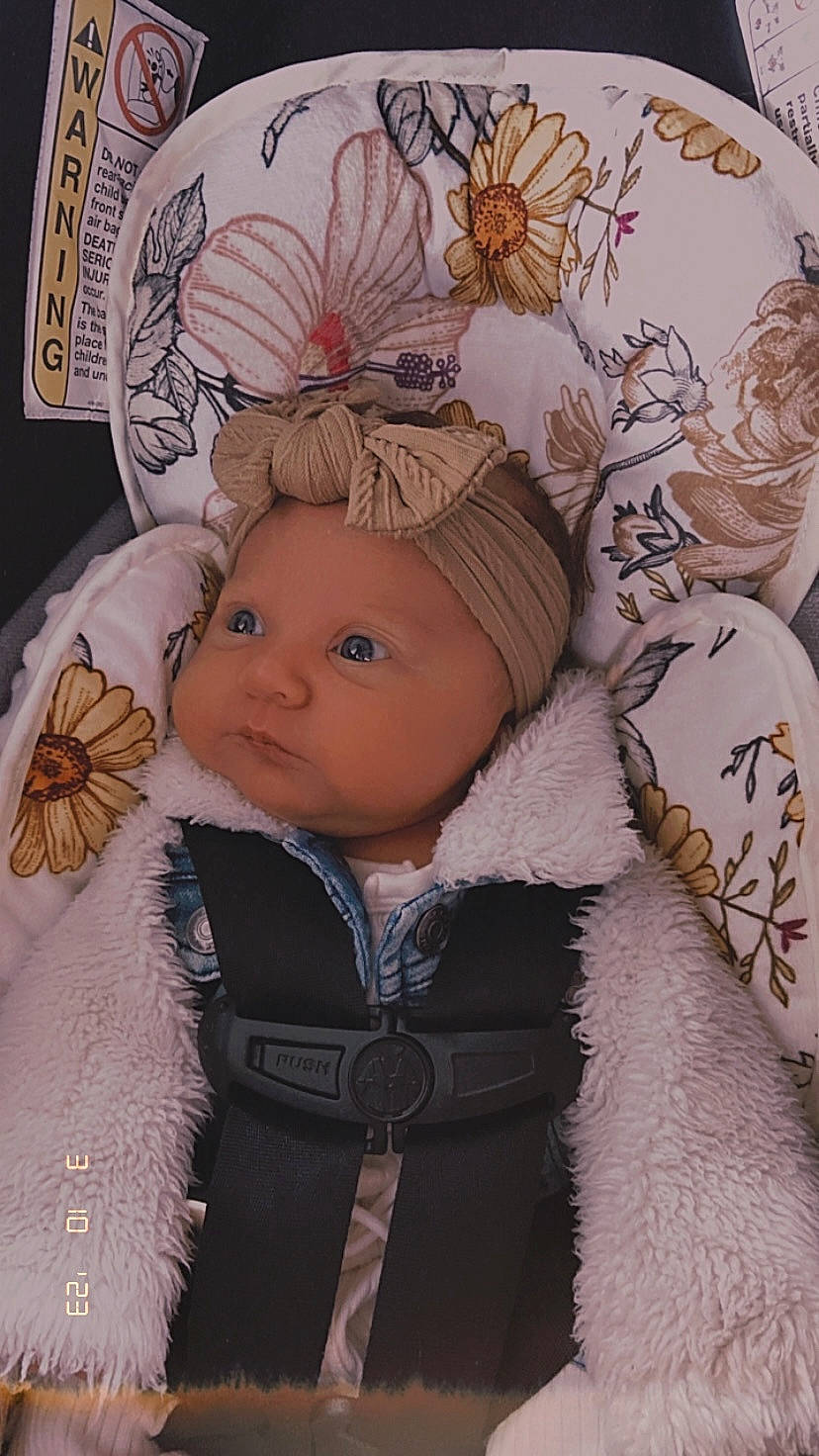 Charlie is registered to the contest to win money with this photo: art, cap, child, costume_hat, event, eye, fur, fur_clothing, happy, head, headgear, headwear, human_body, mammal, ornament, outerwear, person, sleeve, textile, toddler