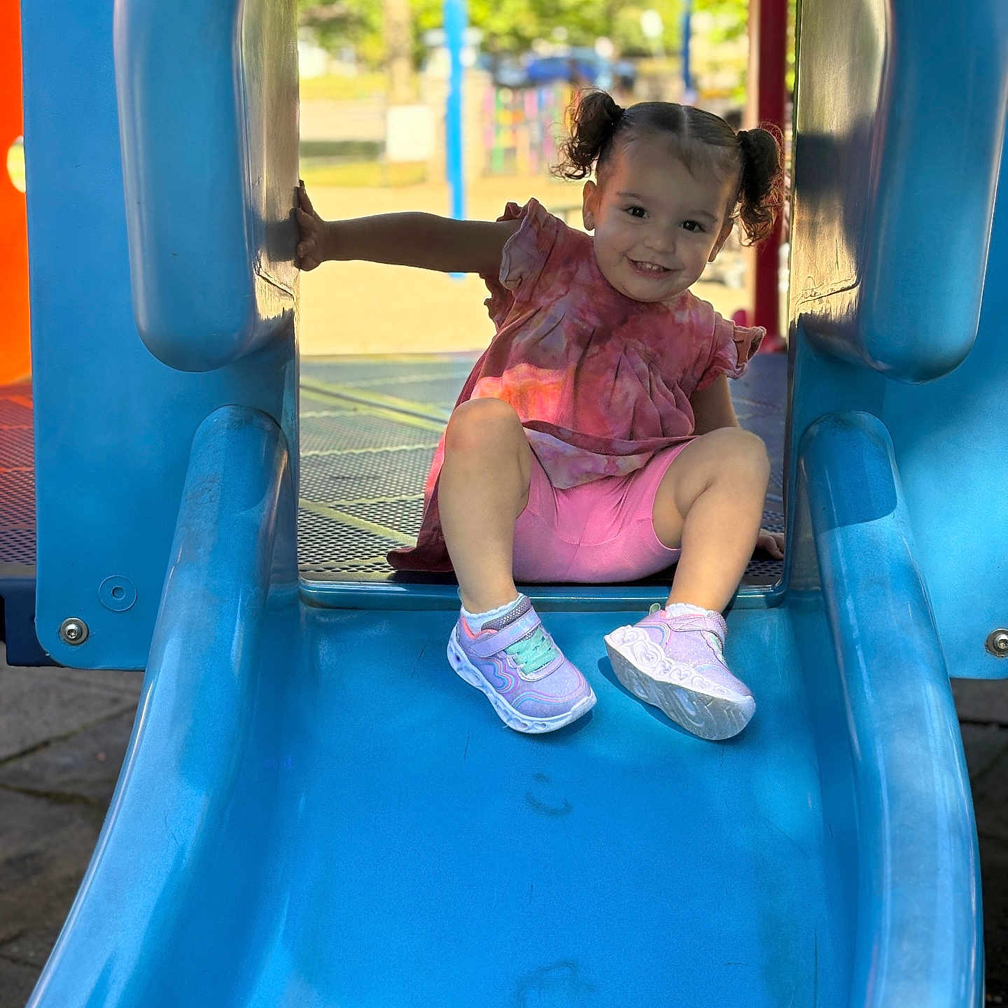 Celine joined the competition — help win amazing prizes! blue_slide, casual_wear, child, cute, daylight, fun, happy, outdoor, park, person, pigtails, pink_clothing, play, playground, recreation, shoes, slide, smiling, summer, toddler