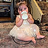 Itzayana is registered to the contest to win money with this photo: baby, cables, candid, carpet, child, chips_bag, clothing, cute, dress, floor, framed_photo, hair, indoors, milk_bottle, playful, portrait, sitting, stairs, toddler, toy