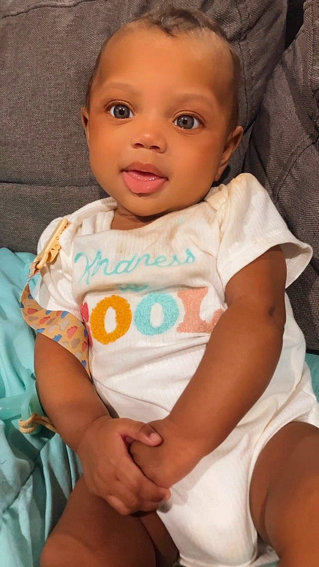 Athena joined the competition — help win amazing prizes! baby, baby_toddler_clothing, cheek, child, comfort, elbow, happy, human, iris, linens, nose, person, pink, sitting, skin, sleeve, smile, t_shirt, thigh, toddler