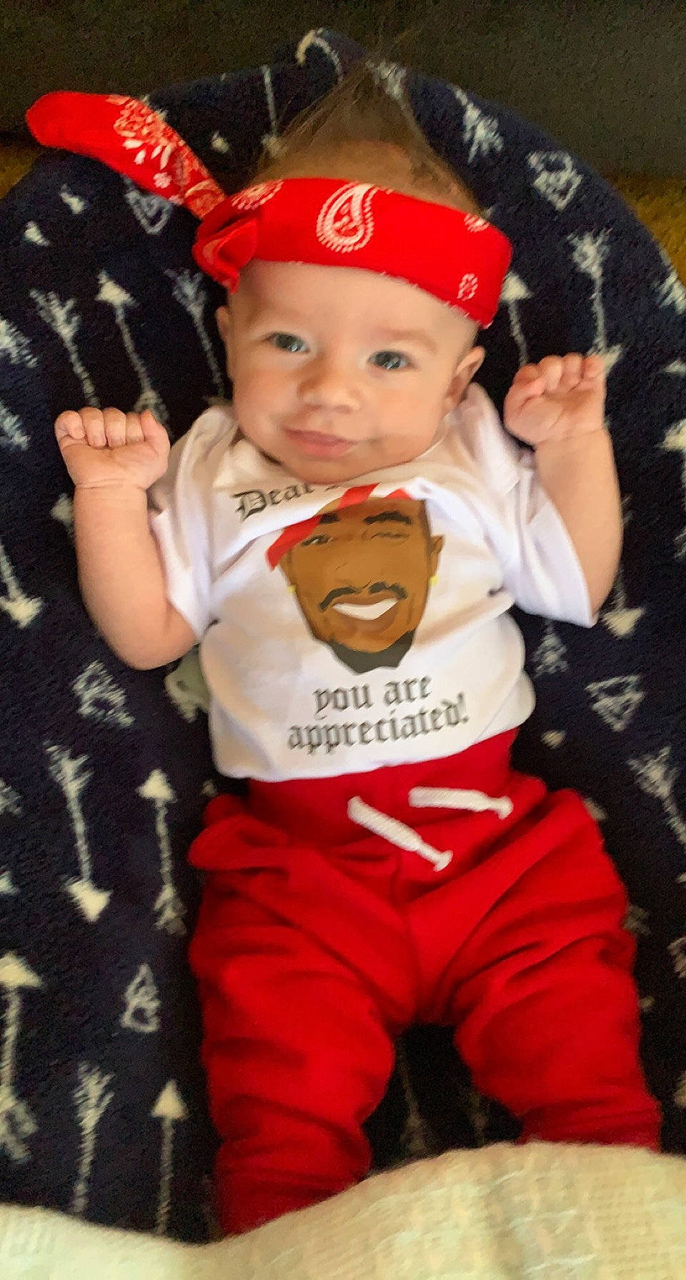 Paxton is registered to the contest to win money with this photo: baby, baby_toddler_clothing, baseball_cap, cap, carmine, child, costume, costume_hat, event, facial_expression, fictional_character, fun, happy, hat, headwear, person, red, sleeve, smile, t_shirt