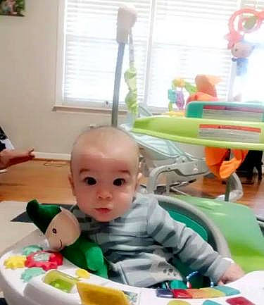 Xander joined the competition — help win amazing prizes! baby, baby_products, baby_toddler_clothing, baby_toys, chair, child, flooring, fun, green, leisure, person, plastic, play, room, sitting, table, toddler, toy, window, window_blind