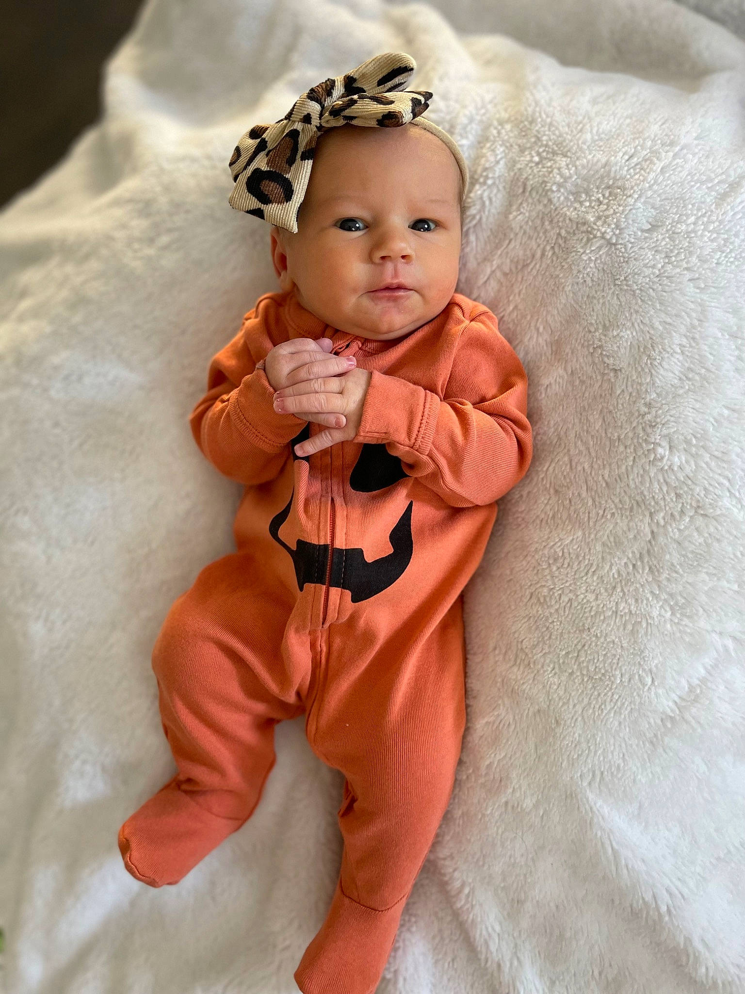 Chloe is registered to the contest to win money with this photo: baby, baby_toddler_clothing, brown_hair, cheek, child, doll, embellishment, fashion_accessory, head, headband, headpiece, jewellery, linens, orange, peach, person, pink, skin, sleeve, toddler