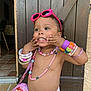 Syana a rejoint le concours — aidez-le/la à gagner de superbes lots ! bracelets, child, colorful, cute, diaper, fashion_accessories, happy, indoor, necklaces, person, pink, playful, portrait, purse, smiling, sunglasses, tile_floor, toddler, wooden_door, young_child