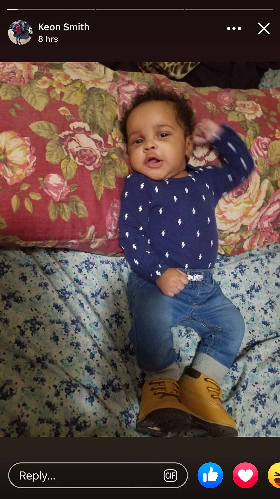 Asiah is registered to the contest to win money with this photo: baby, cheek, child, fun, pattern, person, sitting, smile, standing, textile, toddler