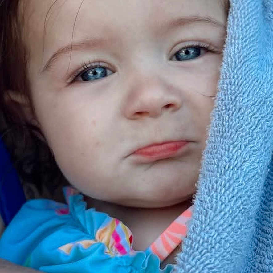Blakely joined the competition — help win amazing prizes! toddler, child, blue_towel, pouty_face, blue_eyes, wet_hair, outdoor, portrait, close_up, baby, cute, wrapped, clothing, skin, expression, person, young_child, natural_light, summer, water_droplets