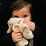 child, baby, toddler, blanket, stuffed_toy, lovey, hands, eyes, face, hair, car_seat, seatbelt, portrait, close_up, cozy, soft_texture, cute, infant, grasping, plush