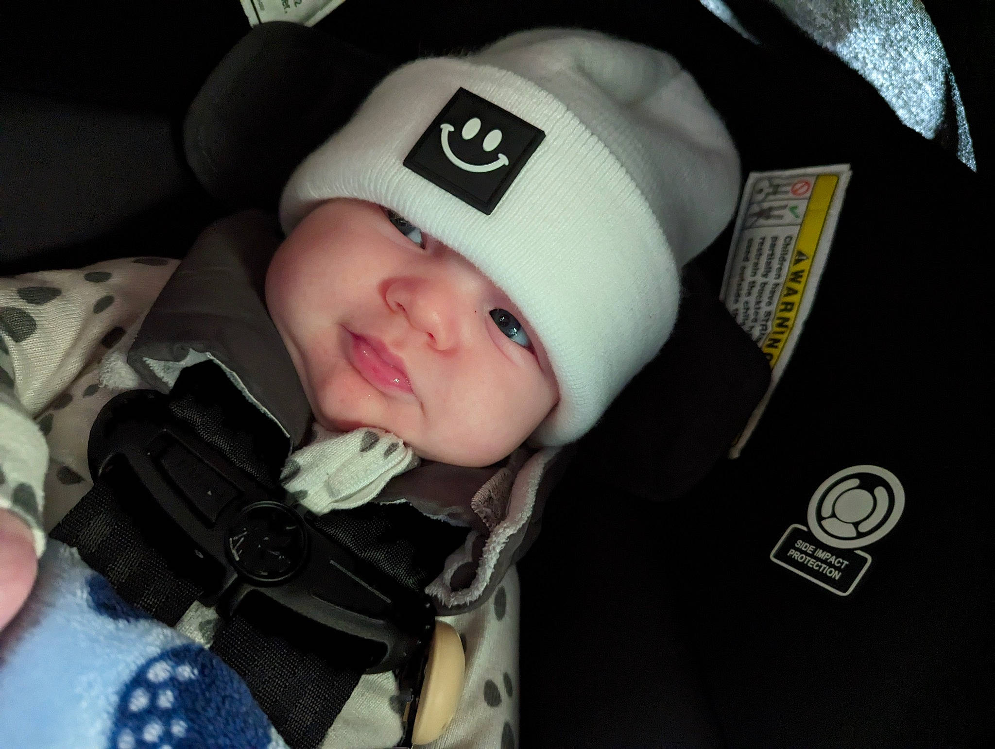 Flynn is registered to the contest to win money with this photo: baby, baby_carriage, baby_in_car_seat, baby_products, baby_safety, baby_toddler_clothing, cap, car_seat, cheek, child, comfort, eye, fashion_accessory, hat, headgear, headwear, helmet, person, personal_protective_equipment, sleeve