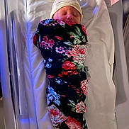 Haylo joined the competition — help win amazing prizes! newborn, baby, swaddled, blanket, floral, hat, sleeping, hospital_bed, white, infant, peaceful, sleep, cozy, child, portrait, person, wrapped, indoors, soft_lighting, resting
