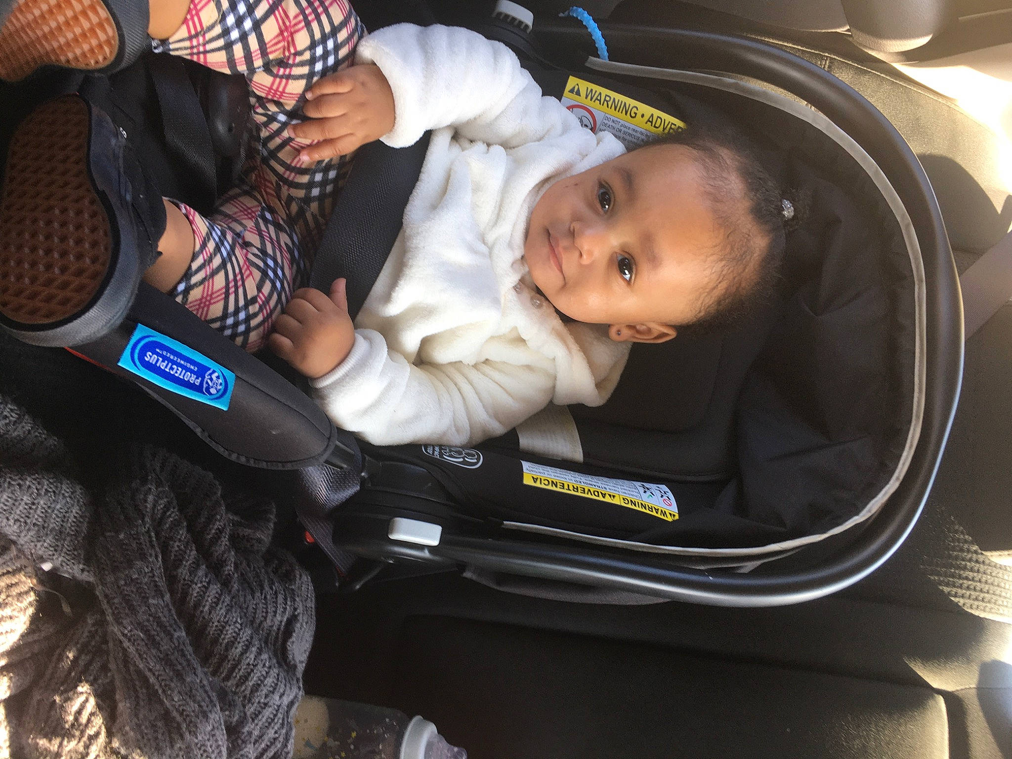 Annika is registered to the contest to win money with this photo: auto_part, automotive_design, baby, baby_carriage, baby_in_car_seat, baby_products, baby_safety, baby_toddler_clothing, car_seat, car_seat_cover, child, comfort, family_car, luxury_vehicle, motor_vehicle, person, seat_belt, sitting, steering_part, toddler