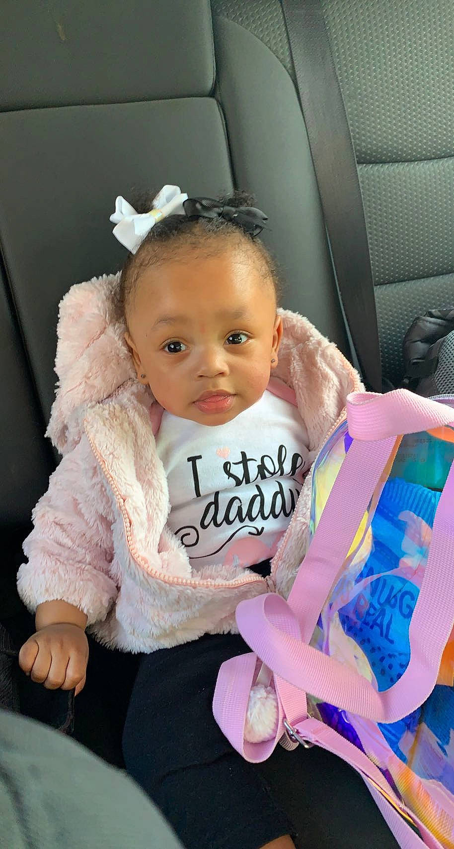 Annika joined the competition — help win amazing prizes! baby, baby_carriage, baby_products, baby_toddler_clothing, car_seat, cheek, child, comfort, cool, face, fashion_accessory, fun, happy, person, pink, sitting, skin, sleeve, steering_wheel, toddler