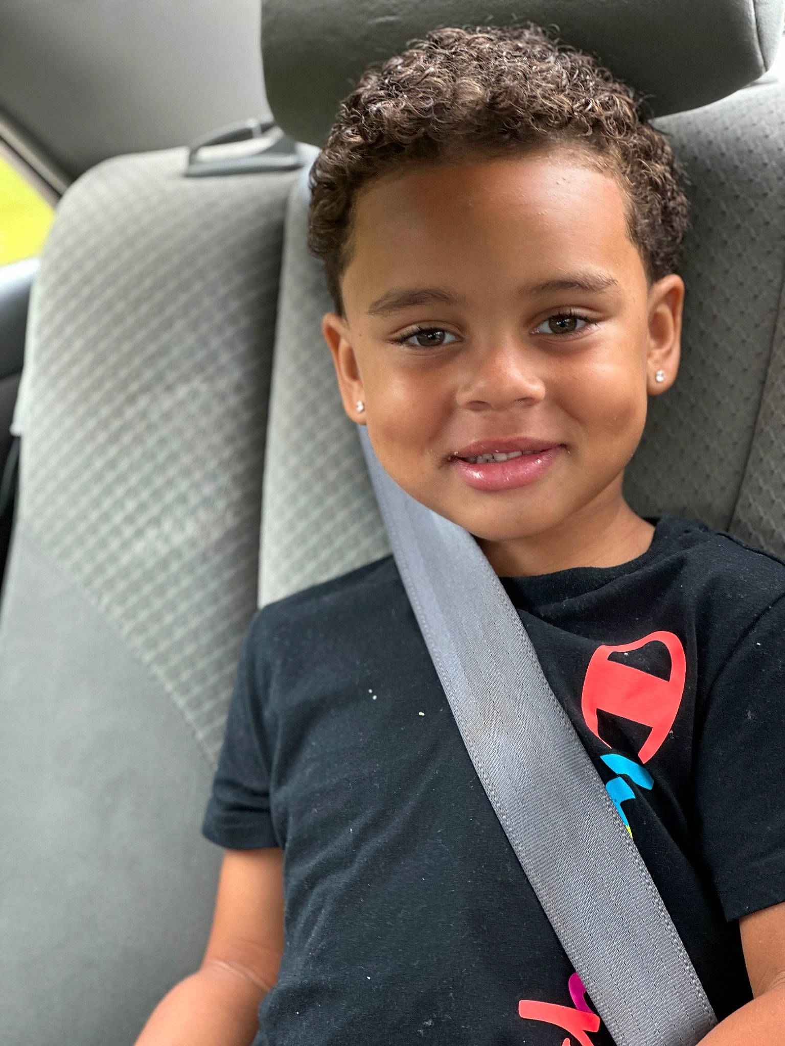 Amiri joined the competition — help win amazing prizes! automotive_design, automotive_exterior, car, car_seat, car_seat_cover, child, electric_blue, face, family_car, flash_photography, forehead, happy, head_restraint, joy, motor_vehicle, person, personal_luxury_car, smile, t_shirt, toddler