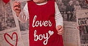 Ezjahramos is registered to the contest to win money with this photo: toddler, child, baby, red_romper, lover_boy, smiling, standing, white_socks, background_newspapers, valentine, heart, red_balloons, indoor, portrait, cute, happy, clothing, baby_boy, studio_photo, infant