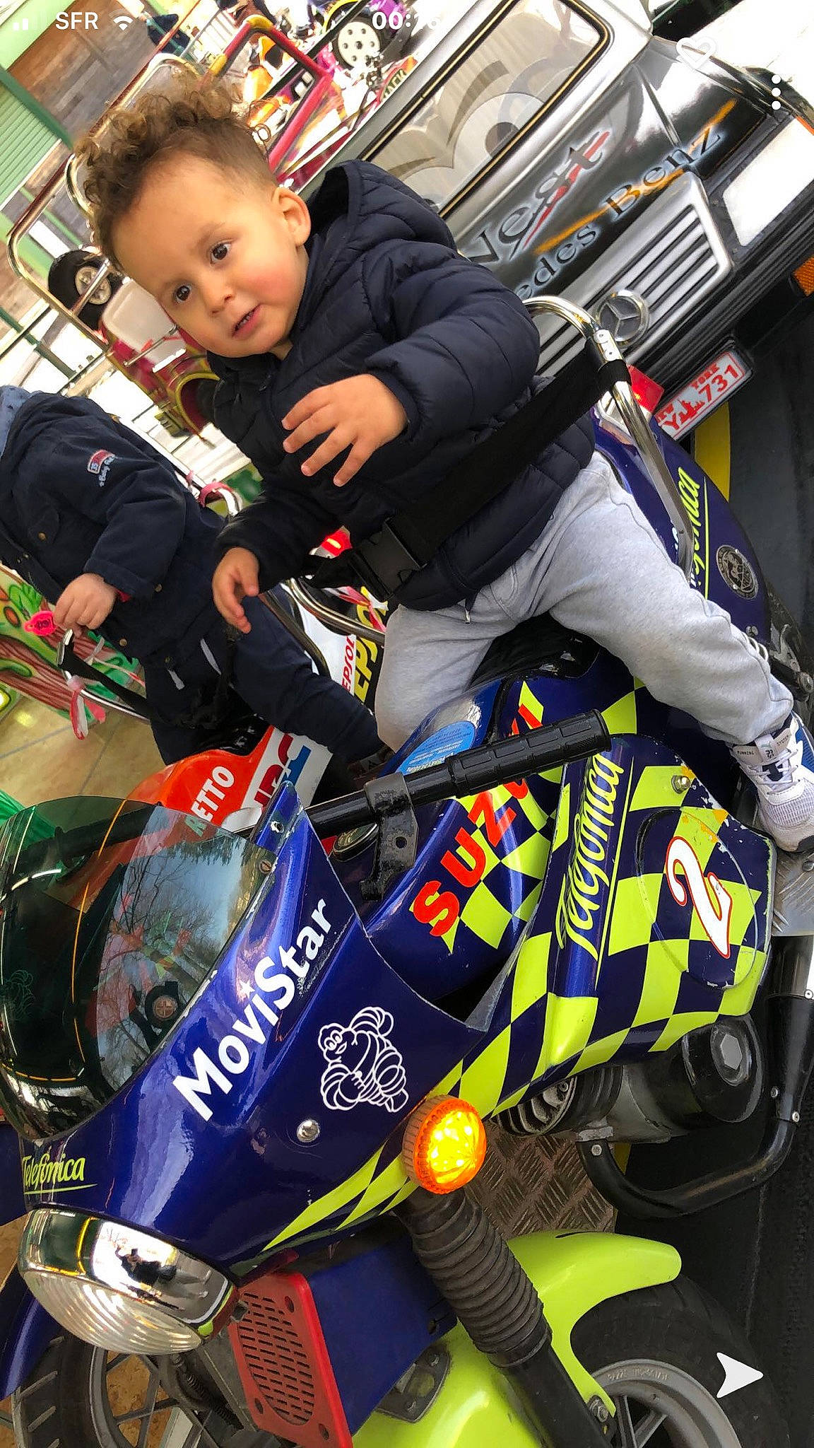 Kaïs a rejoint le concours — aidez-le/la à gagner de superbes lots ! auto_part, auto_racing, automotive_design, automotive_exterior, automotive_tire, automotive_wheel_system, event, human_leg, motor_vehicle, motorcycle, motorcycle_helmet, motorcycle_racer, motorcycling, motorsport, person, racing, smile, sportswear, tire, toddler