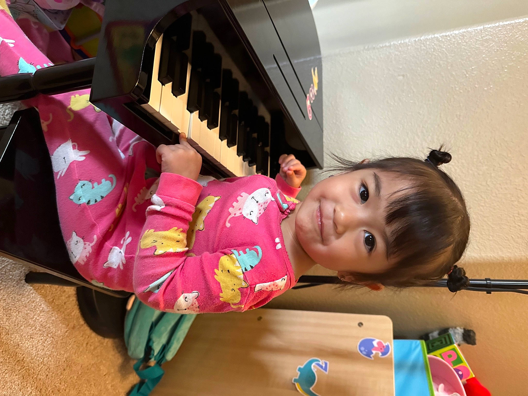 Lana is registered to the contest to win money with this photo: baby, chair, child, electronic_musical_instrument, fun, happy, house, joy, keyboard, leisure, magenta, musical_keyboard, person, piano, play, room, sitting, skin, smile, toddler