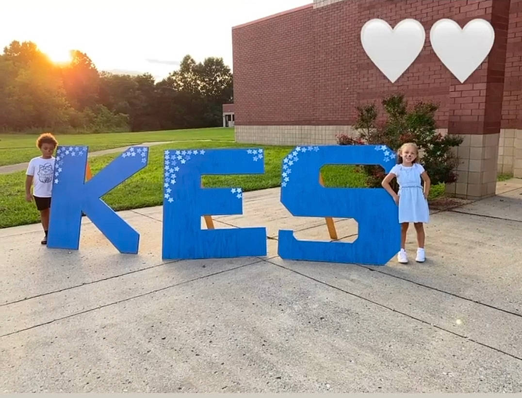 Braylon is registered to the contest to win money with this photo: asphalt, azure, child, city, daytime, electric_blue, font, fun, grass, joy, landscape, leisure, logo, person, plant, recreation, road, road_surface, sky, t_shirt
