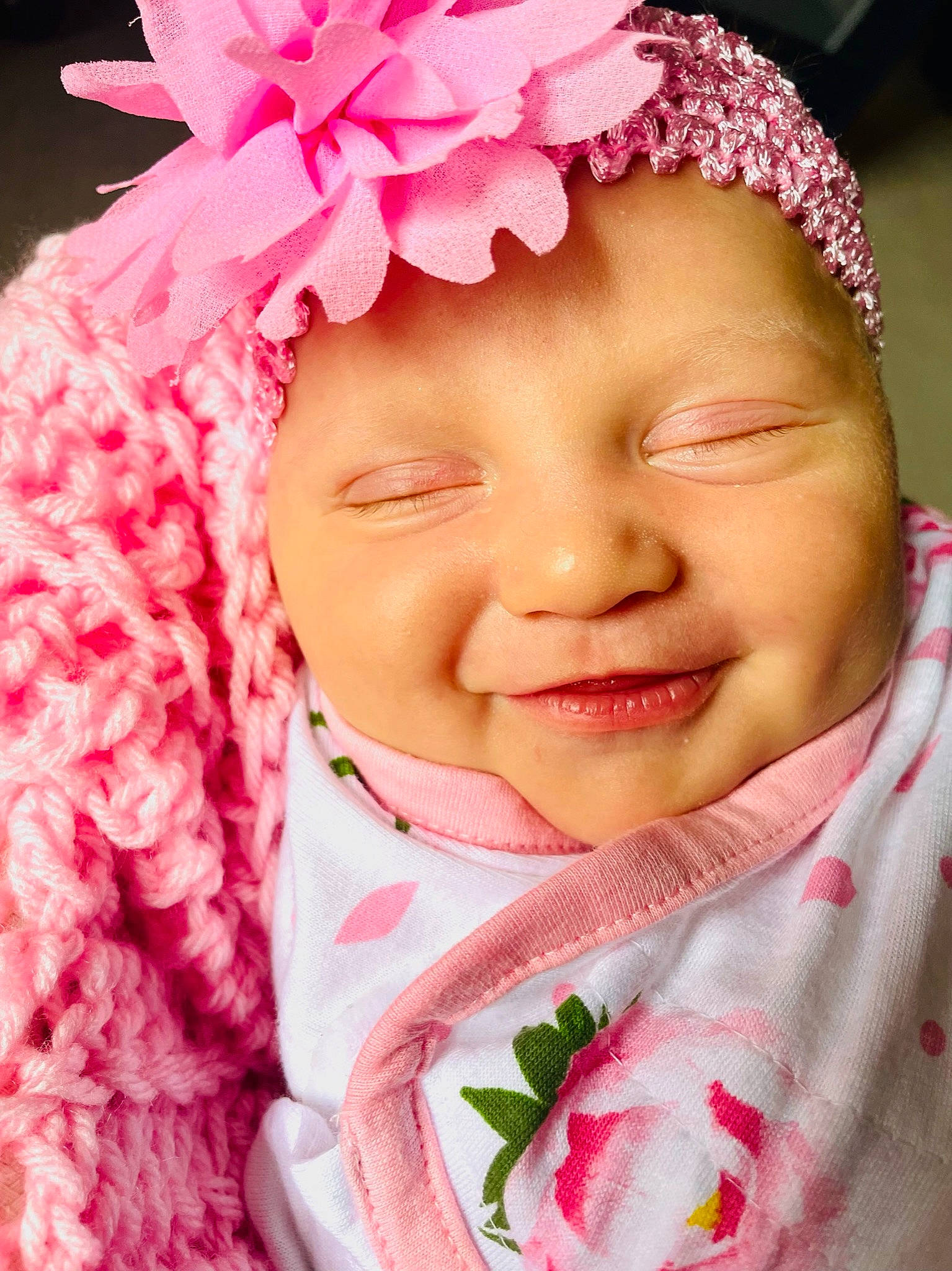 Adley is registered to the contest to win money with this photo: baby, baby_toddler_clothing, cheek, chin, dress, eyelash, face, flower, happy, head, headgear, headwear, lip, magenta, nose, person, petal, pink, plant, skin