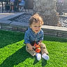 Christopher joined the competition — help win amazing prizes! toddler, child, toy, grass, outdoor, sunlight, tree, people, casual_clothing, jeans, socks, playful, happy, nature, daytime, park, relaxing, curly_hair, smiling, leisure