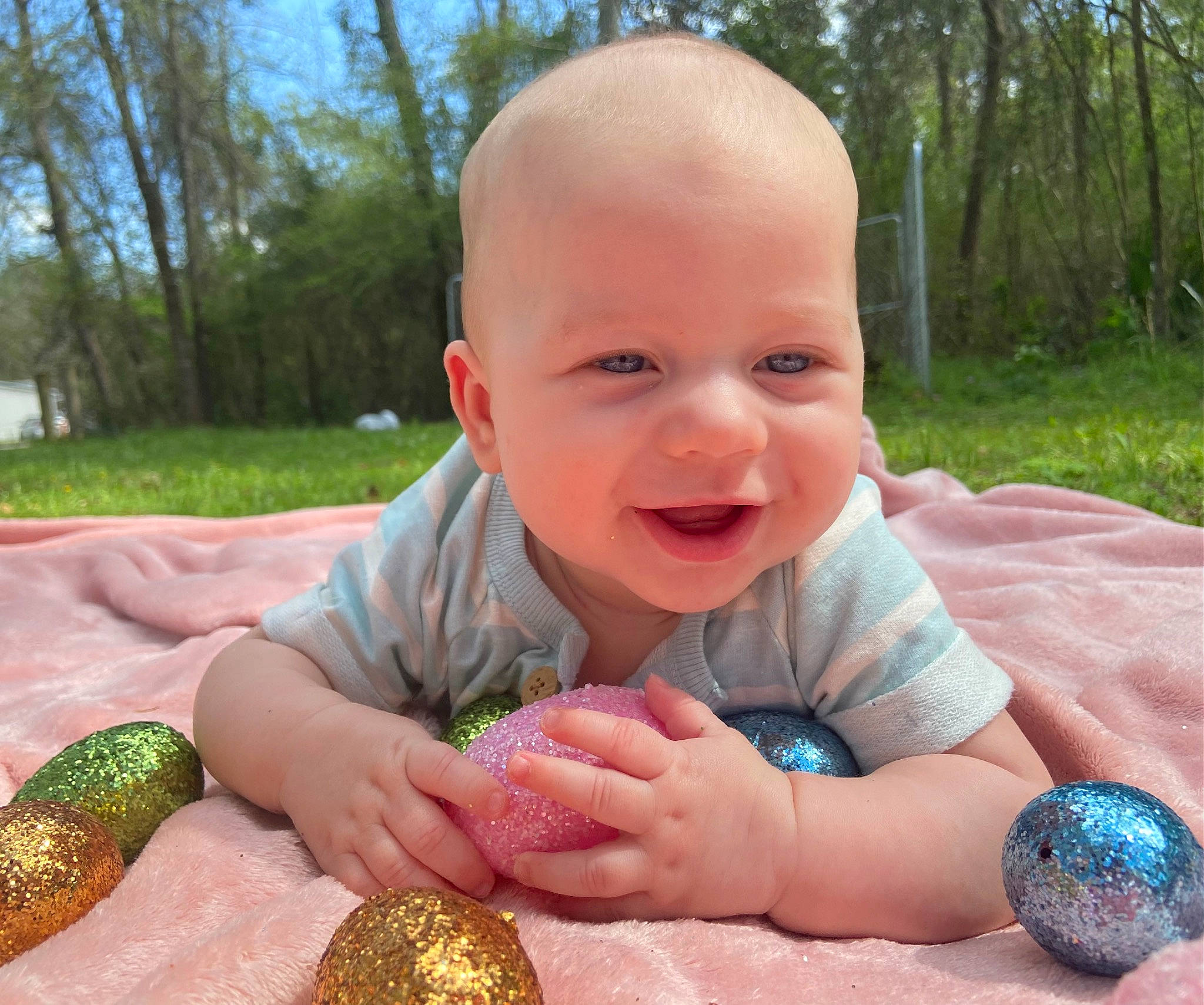 Kace joined the competition — help win amazing prizes! arm, baby, baby_laughing, baby_toddler_clothing, finger, grass, hand, happy, mammal, nail, nose, people_in_nature, person, plant, sitting, skin, smile, thumb, toddler, tree