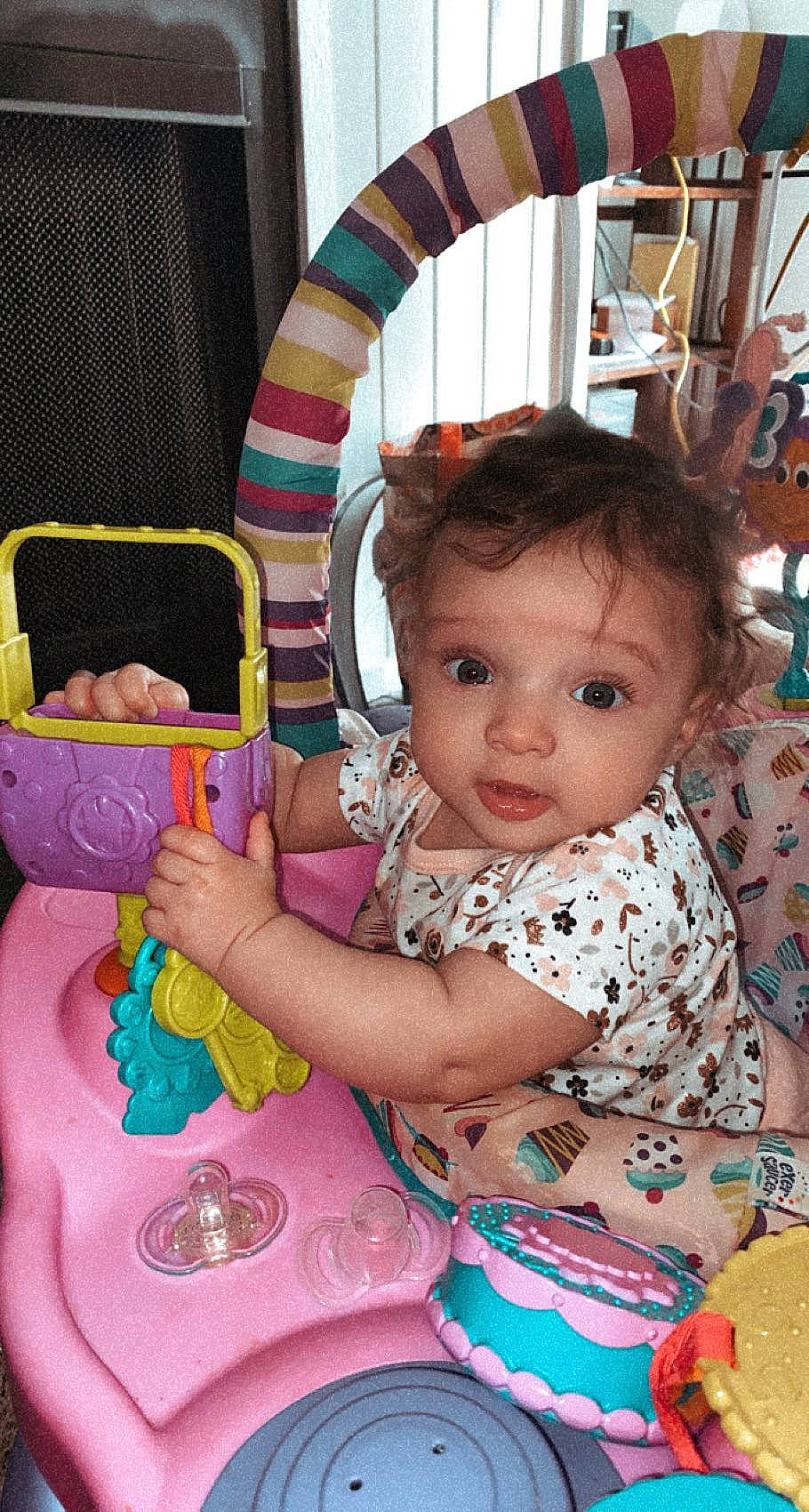 Ily is registered to the contest to win money with this photo: arm, baby, baby_toddler_clothing, cheek, child, eye, face, fun, hairstyle, happy, head, human, human_body, iris, people, person, photograph, pink, product, skin