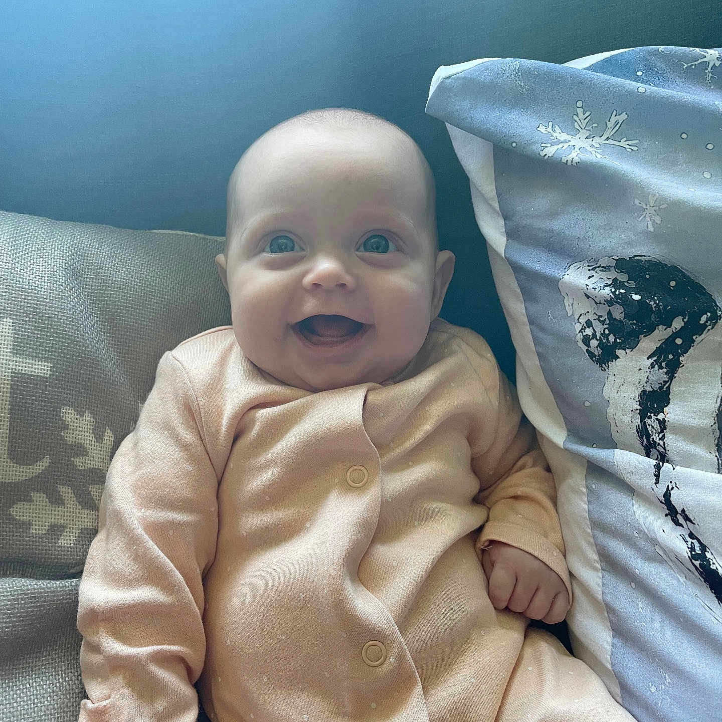 Eden-Sage is registered to the contest to win money with this photo: baby, babylaughing, bed, bedroom, blanket, clothing, cushion, face, furniture, happy, head, homedecor, newborn, pants, person, photography, portrait, quilt, sitting, smile