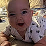 Olivia is registered to the contest to win money with this photo: baby, smiling, infant, bed, onesie, bee_pattern, hands, face, cute, happy, pillow, soft_lighting, indoor, child, person, crawling, closeup, skin, head, expression