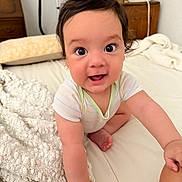 Eziel Justus joined the competition — help win amazing prizes! baby, child, crawling, smiling, bed, blanket, white, hair, happy, indoors, person, cute, infant, eyes, skin, clothing, furniture, hand, foot, expression
