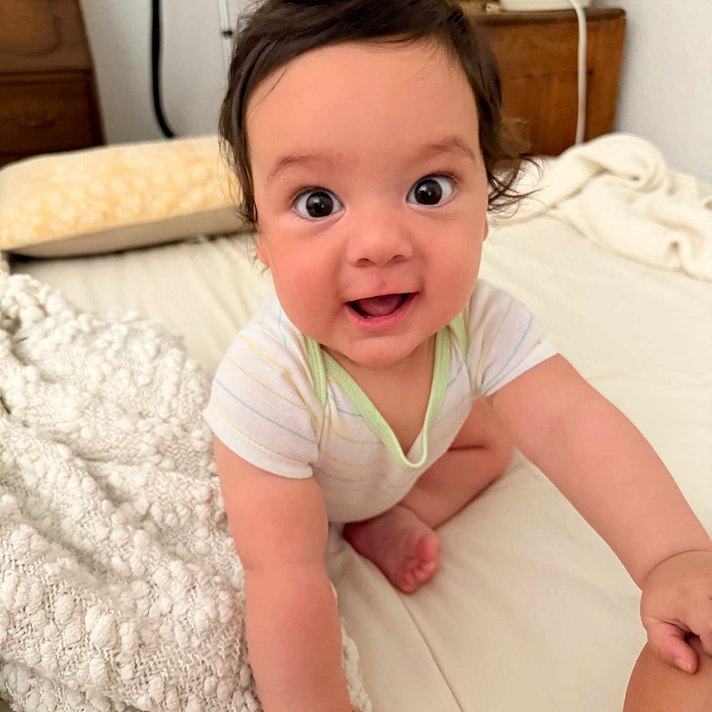Eziel Justus joined the competition — help win amazing prizes! baby, child, crawling, smiling, bed, blanket, white, hair, happy, indoors, person, cute, infant, eyes, skin, clothing, furniture, hand, foot, expression
