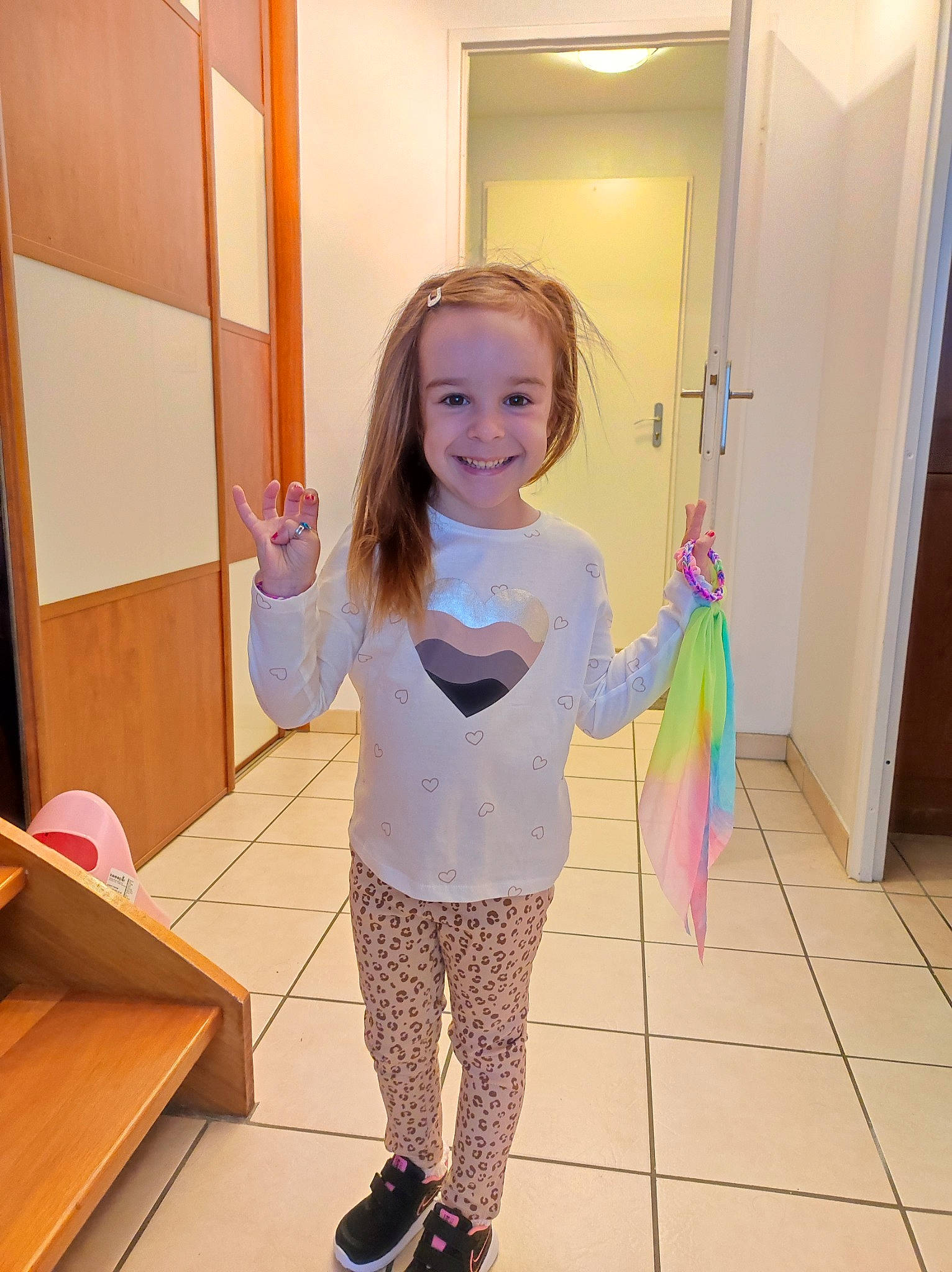 Ilyana participe au concours pour gagner de l'argent avec cette photo : baby_toddler_clothing, child, door, floor, flooring, fun, happy, hardwood, house, joy, knee, magenta, pattern, person, pink, play, room, smile, standing, toddler