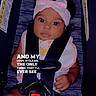 baby, infant, car_seat, headband, pink_bow, straps, safety, child, cute, wide_eyes, soft_toy, warning_label, text_overlay, dark_background, portrait, seated, clothing, love, expression, closeup