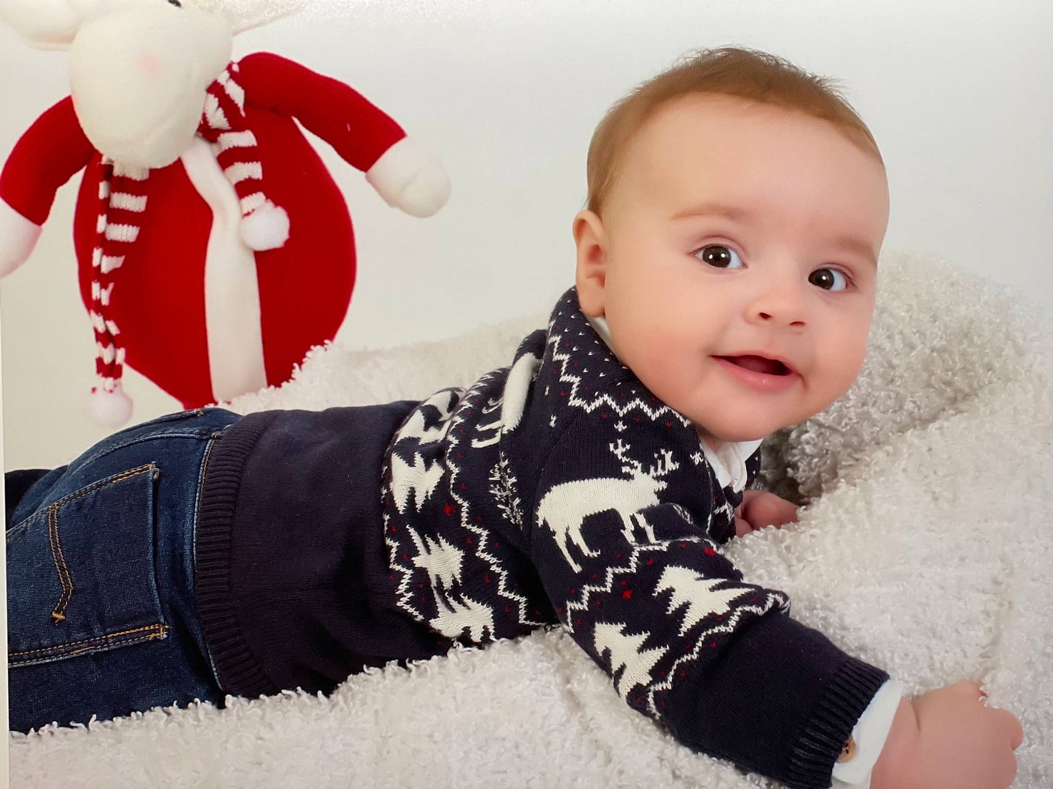 Eduard is registered to the contest to win money with this photo: baby_toddler_clothing, comfort, face, facial_expression, flash_photography, gesture, happy, head, human, mammal, organ, outerwear, person, pink, skin, sleeve, smile, standing, textile, toddler