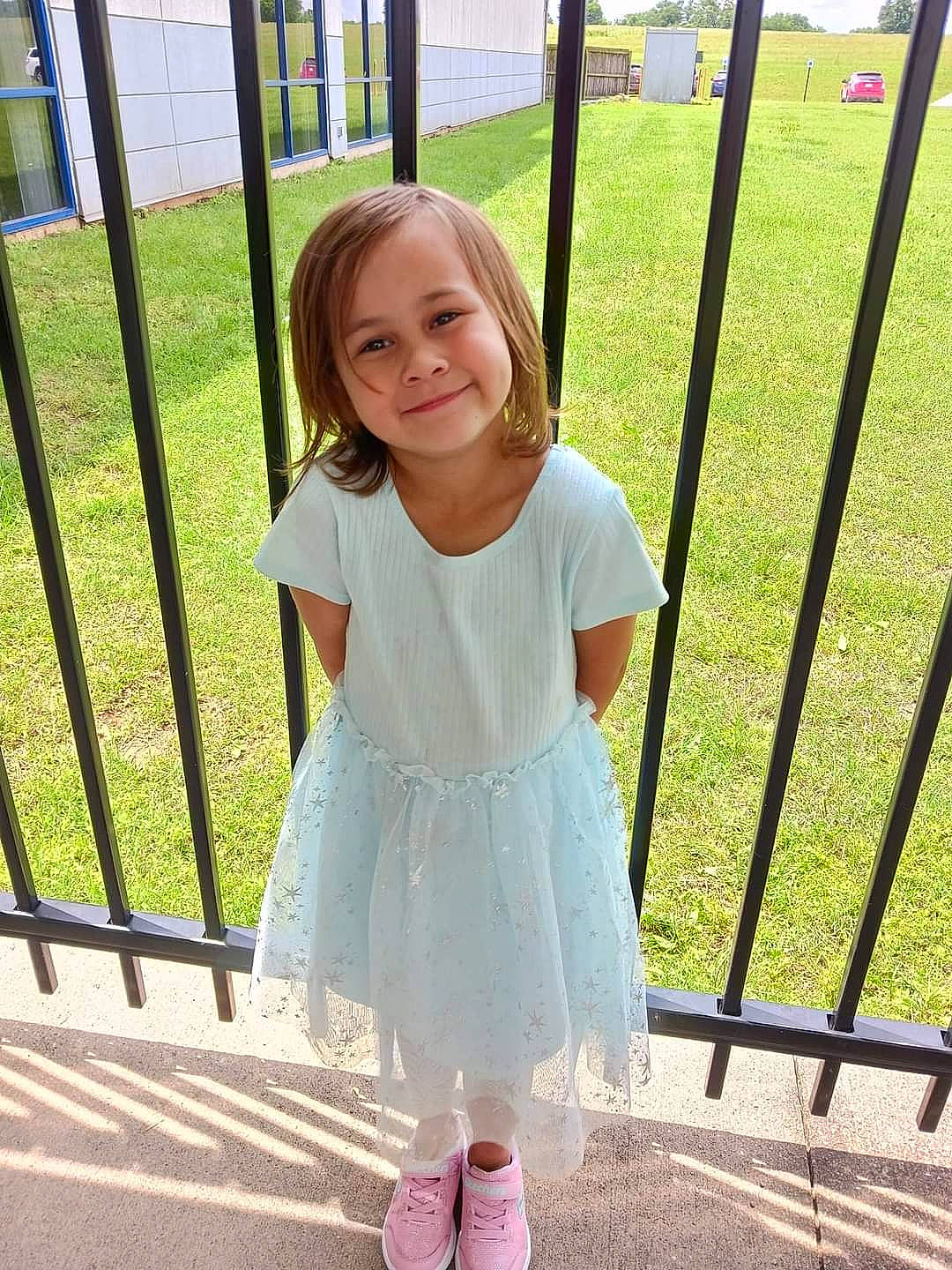 Olivia joined the competition — help win amazing prizes! baby_toddler_clothing, beauty, child, day_dress, dress, fence, fun, grass, hairstyle, happy, joy, leaf, leisure, pattern, person, recreation, sleeve, smile, standing, summer