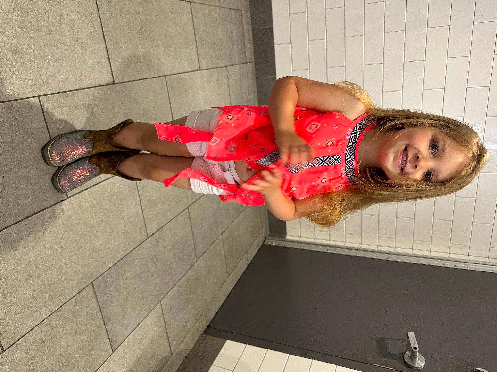 Adelynn is registered to the contest to win money with this photo: calf, carmine, dress, flooring, foot, fun, human_leg, joint, joy, knee, leg, magenta, pattern, person, sandal, shoe, shorts, smile, sock, thigh