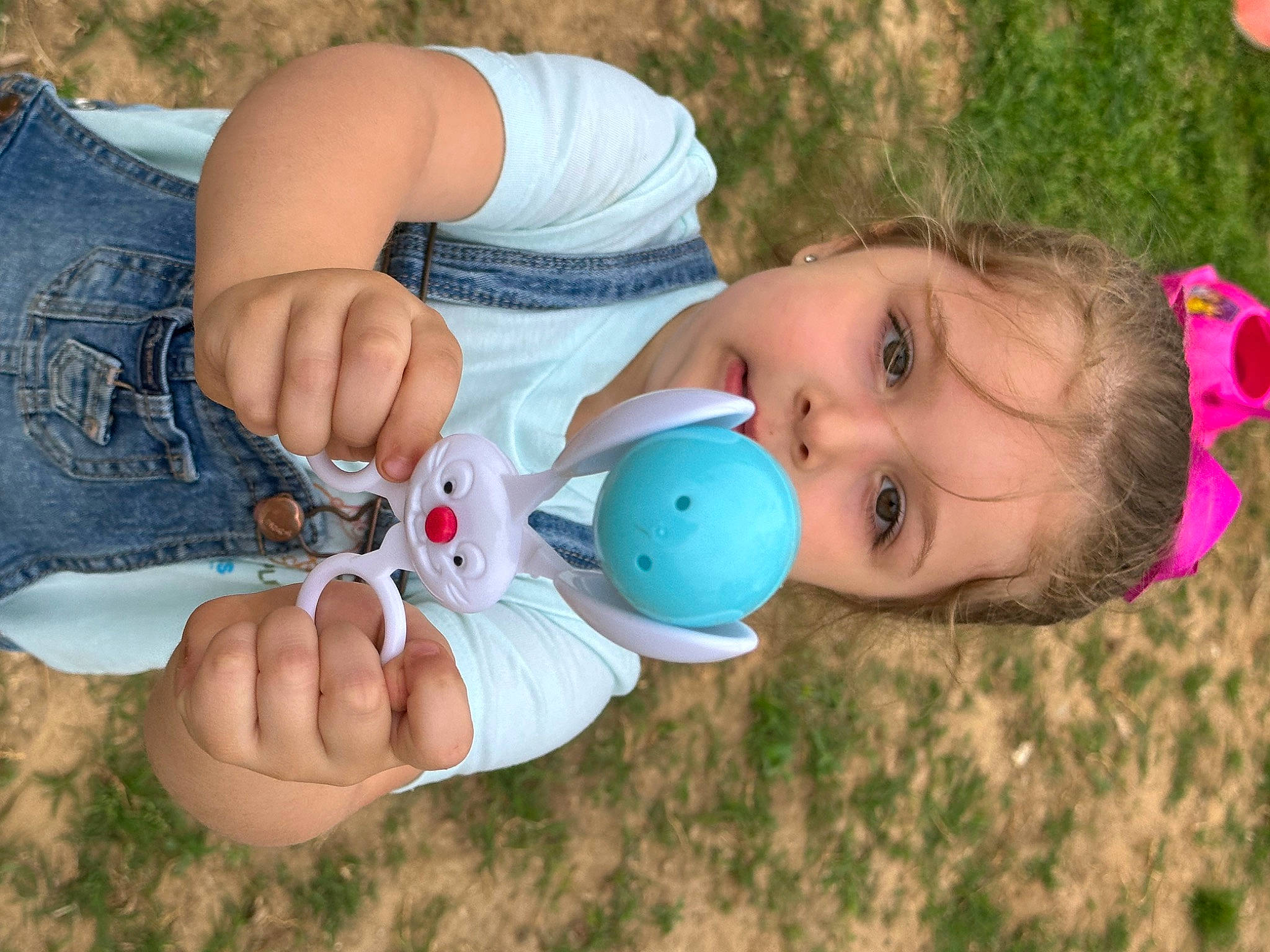 Adelynn is registered to the contest to win money with this photo: baby, baby_toddler_clothing, beauty, child, electric_blue, finger, fun, gesture, grass, happy, leaf, leisure, nail, people_in_nature, person, pink, skin, textile, thumb, toddler