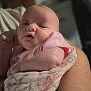 Xena is registered to the contest to win money with this photo: baby, infant, face, arm, blanket, pink_clothing, sleepy, closeup, newborn, skin, person, child, cute, wrapped, soft, adorable, cradled, indoor, newborn_baby, portrait