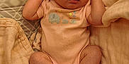 Xena is registered to the contest to win money with this photo: baby, sleeping, infant, onesie, blanket, soft, cozy, cute, peaceful, newborn, skin, hands, feet, face, indoors, resting, comfort, child, portrait, sleep