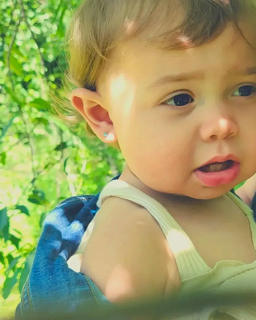 Gracelynn joined the competition — help win amazing prizes! baby_toddler_clothing, cheek, chin, close_up, ear, eye, eyelash, grass, happy, human_body, iris, lip, nose, people_in_nature, person, plant, skin, smile, toddler, tree