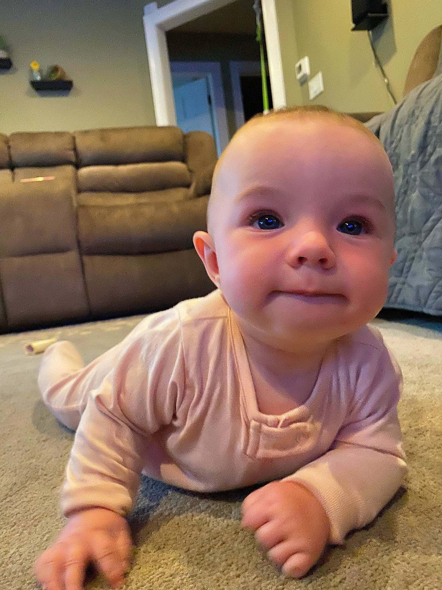 Scarlett is registered to the contest to win money with this photo: baby, baby_toddler_clothing, cheek, child, chin, comfort, couch, crawling, flooring, hairstyle, hardwood, iris, lip, mouth, nose, person, picture_frame, skin, thumb, toddler