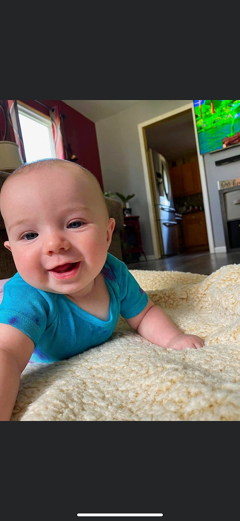Scarlett joined the competition — help win amazing prizes! baby, baby_toddler_clothing, child, comfort, finger, floor, flooring, fun, happy, linens, person, picture_frame, room, sitting, skin, sleeve, smile, t_shirt, thumb, toddler